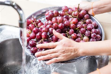 Luckily, washing grapes is a simple process that only takes a few minutes. Before washing, make sure your hands and colander are clean. Also, remove any damaged grapes from the bunch and discard them. 